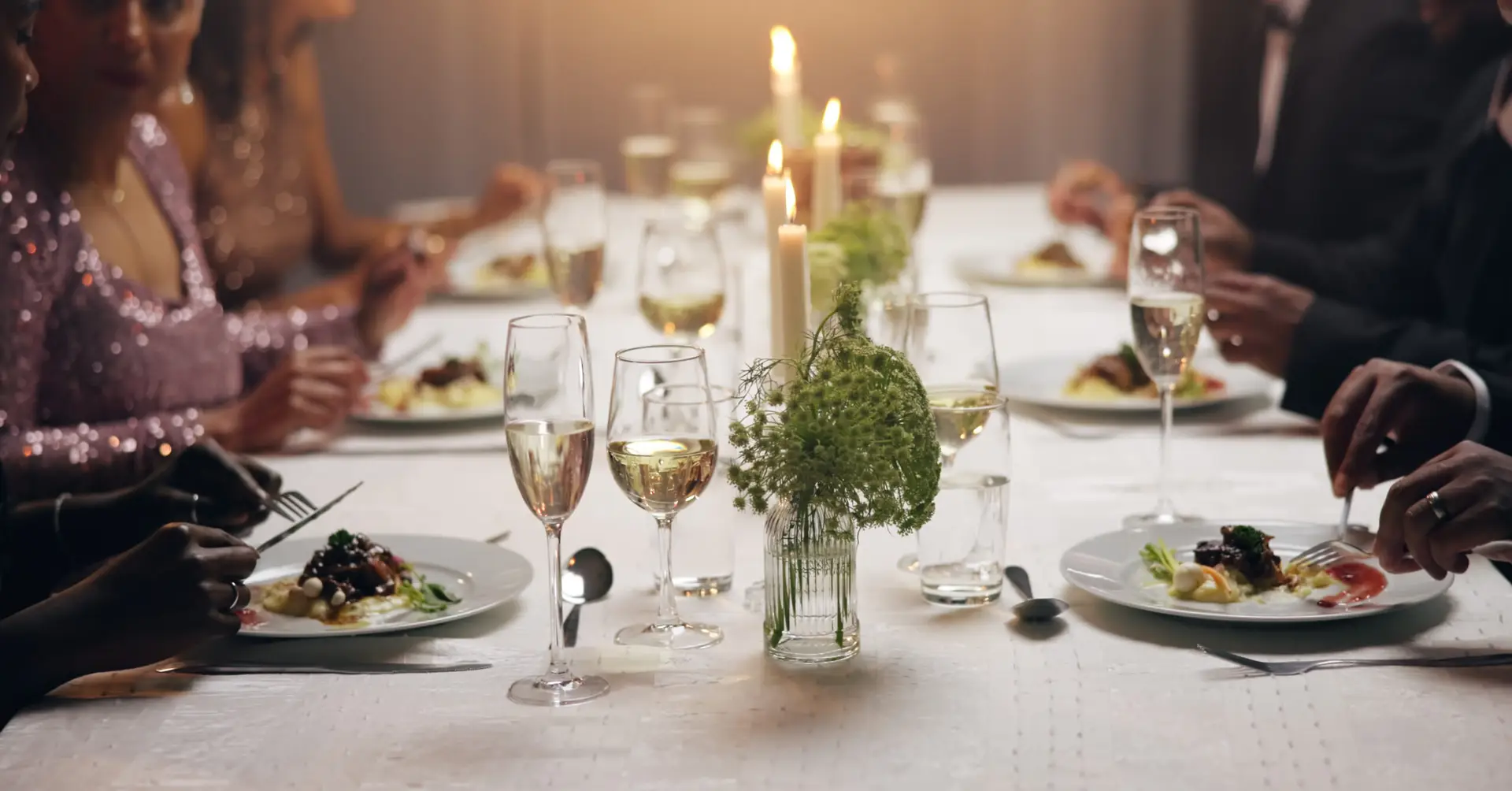 Hands, dinner and business people at party with food, drinks or plate for charity drive at night. Group, friends and luxury fine dining for fundraiser with celebration, alcohol or glass at gala event.